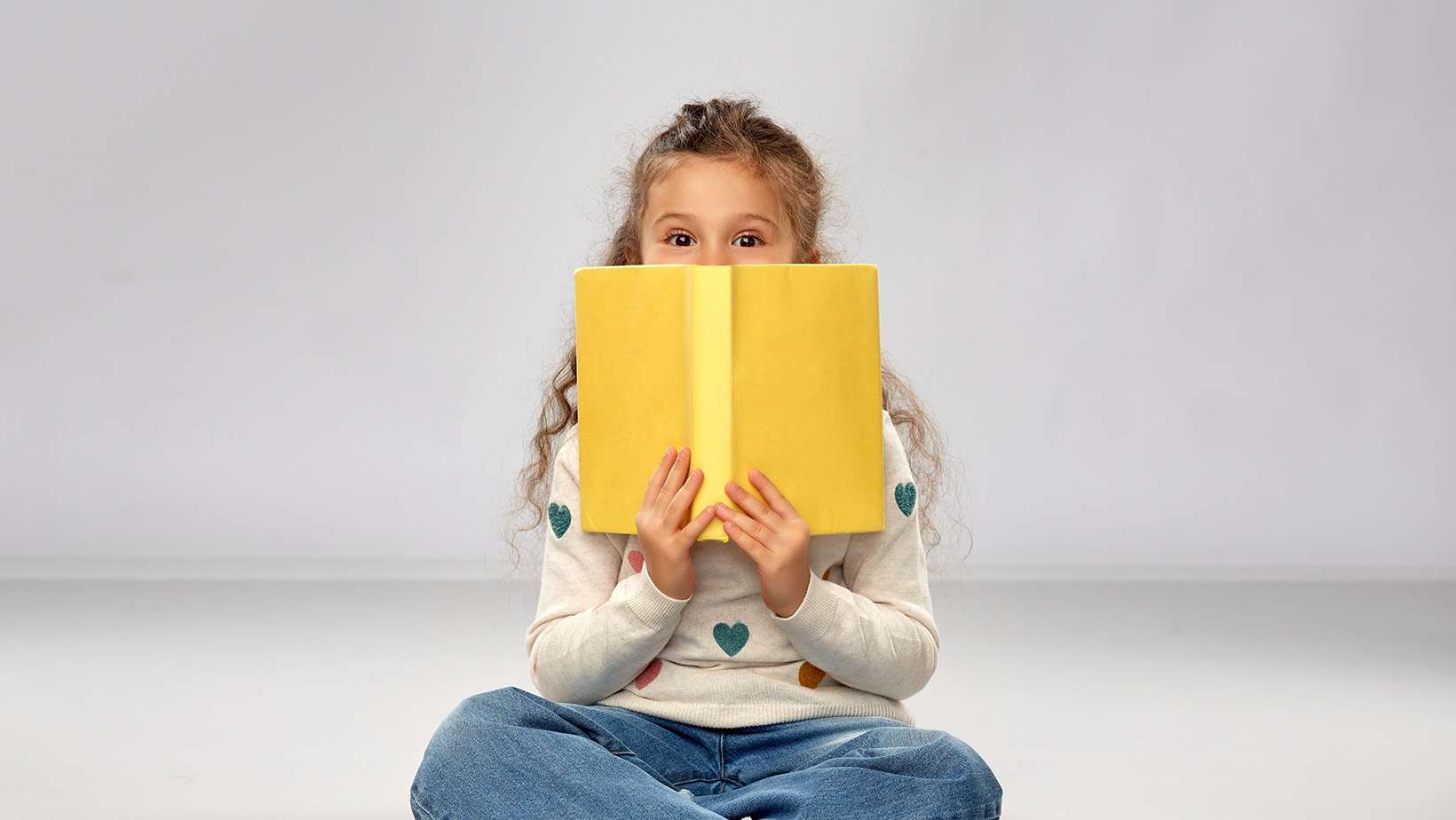Girl Holding a Book - Live Inspired - Medina - Ohio
